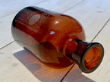 Medicine bottle with engraving
