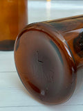 Dark glass storage jar with lid
